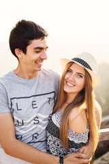 Loving couple who enjoys the embrace of each other in the evening nature