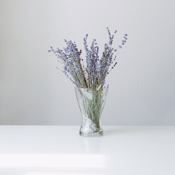 Lavender in glass vase on the white table