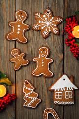 Christmas cookies on a wooden table, top view. Home-made pastries of various shapes