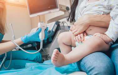 Doctor and little boy patient. Ultrasound equipment. Diagnostics. Sonography.