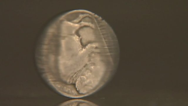 Close up, buffalo nickel spins