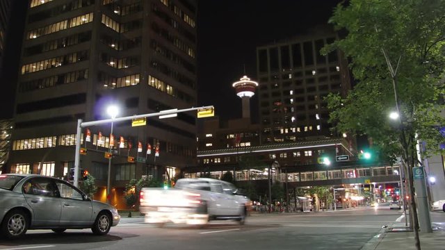 Timelapse, cars drive under Calgary tower