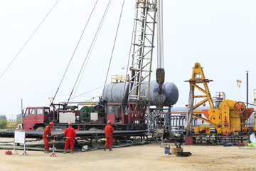 Oil workers are working at the oil fields