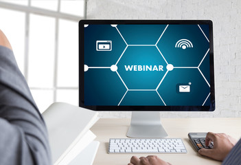 WEBINAR hand on table use E-business Browsing Connection in computer, coffee, Split tone