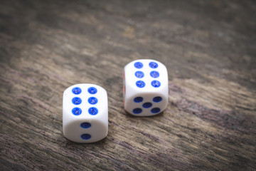 two game dice on the wooden table number six