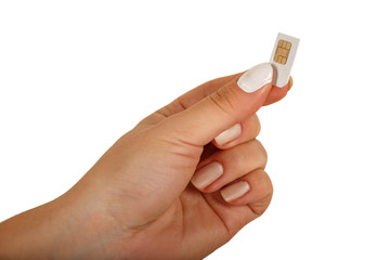 female hand holding white SIM card 