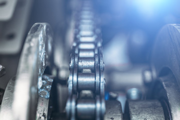 Industrial roller chain, technology background with selective focus