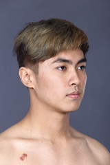 Naklejka premium Asian man before make up hair style. no retouch, fresh face