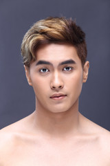 Fototapeta premium Man sexy face topless male model with Different Shading beautiful Color Hair