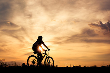 Silhouette man cycling