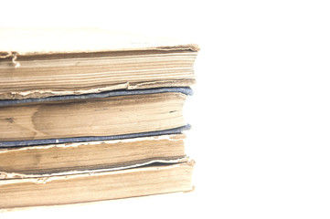Stack of old books isolated on white background