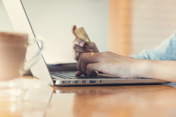 Online shopping concept, Woman shopping using laptop pc and credit card