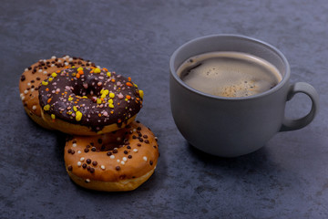 Closeup coffe with donuts