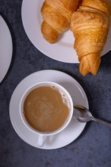 Closeup coffee and fresh croissants