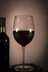 Red wine in a bottle and in a glass