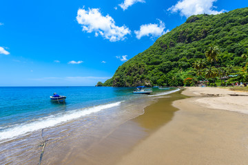 Fototapeta na wymiar Paradise beach at Soufriere Bay with view to Piton at small town Soufriere in Saint Lucia, Tropical Caribbean Island.