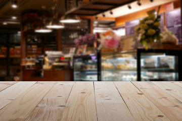 Empty table in front of blurry coffee shop or cafe restaurant with abstract bokhe light background Ready for Create montage product display or design key visual layout banner or panoramic