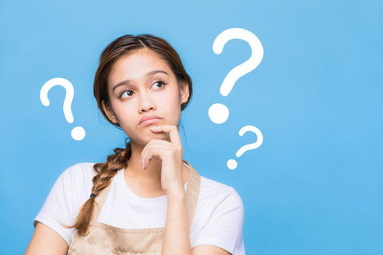 young housewife with question marks.