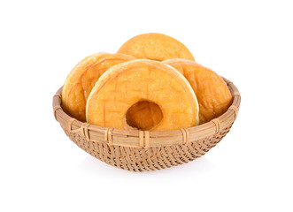 donut in bamboo basket on a white background