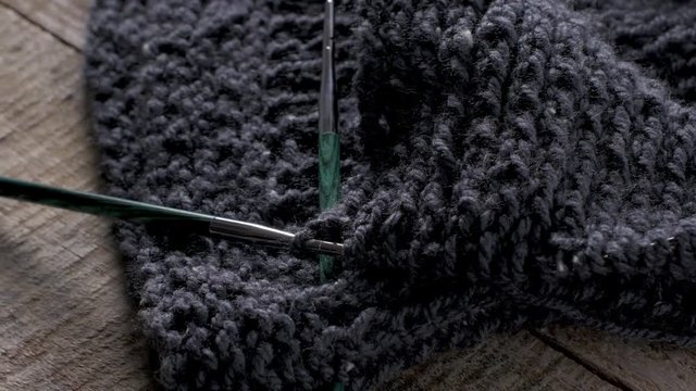 Vintage Knitting needles and yarn on wooden background/natural wool knitting background