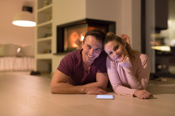 Young Couple using digital tablet on cold winter night