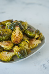 Cooked Brussels sprouts in a white plate
