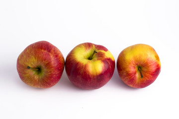 Fototapeta na wymiar Apples on a white background. A group of apples on an isolated white background. Fruits on a white background..