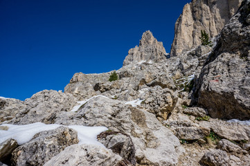 Fototapeta na wymiar Snow mountains at summer sunny day. Dolomites Alps, Rosengarden Group, South Tirol, Italy.