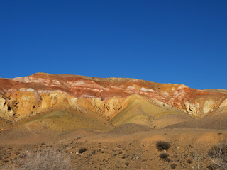Fototapeta na wymiar Martian landscape. Red mountains. Multicolored paint of rock. Mars
