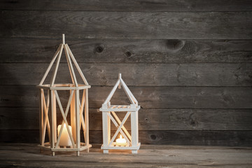 two wooden lanterns on old rustic background