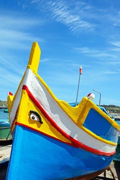 Front view of a traditional Maltese Dghajsa fishing boat, Marsaxlokk, Malta.