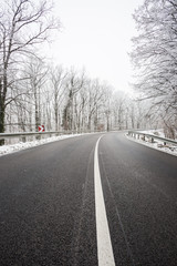Fototapeta premium snowy road at wintertime