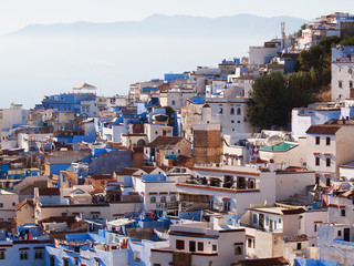 The gorgeous blue streets and blue-washed buildings of Chefchaouen, moroccan blue city- amazing palette of blue and white buildings