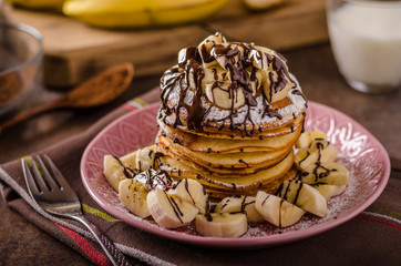 American pancakes with banana, chocolate