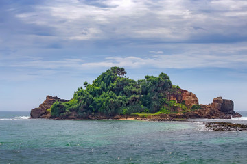 Fototapeta premium Small tropical island in the ocean