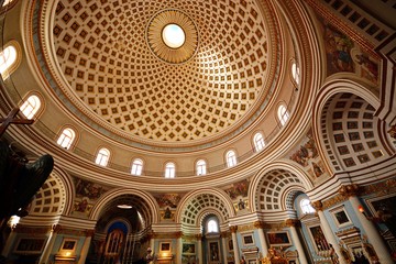 The patterned domed ceiling and niches inside the Rotunda of Mosta, Malta.
