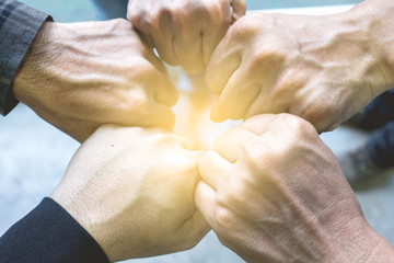 Team Business Partners Giving Fist Bump to Greeting Start up project with Contractor. Corporate Teamwork Partnership in an Office Meeting. Businessman with Hands together.