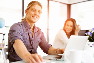 Handsome businessman working at computer