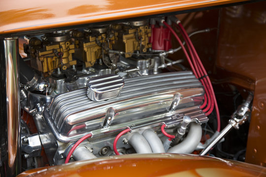 Under the Hood View of Restored Vintage Automobile Engine with Tri-Power Show-Chrome Carburetors 