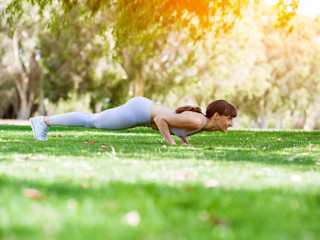 Young woman exercising in the park