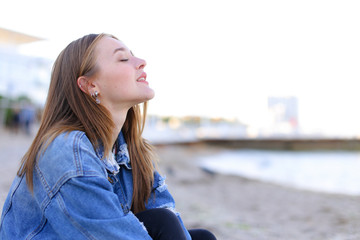 Portrait of cheerful girl who poses on camera and cute laughs si