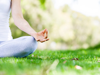 Woman meditating in the park