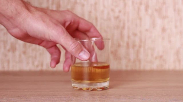 Taking a glass of whiskey