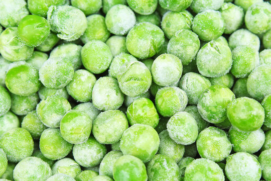 Frozen pea peases texture background. Green pease background pattern. Foog photo.