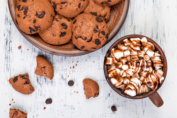Hot chocolate with marshmallow and chocolate cookies. Flat lay.