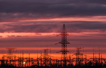 distribution electric substation with power lines and transformers.