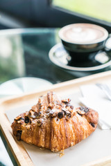 hazelnut croissant with hot coffee
