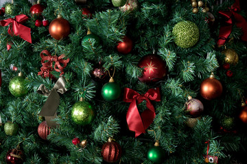Obraz na płótnie Canvas decorated with baubles Christmas tree. part. background