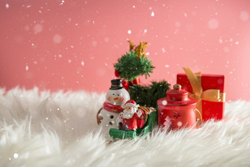 Christmas holiday background with Santa and decorations. Christmas landscape with gifts and snow. Merry christmas and happy new year greeting card with copy-space.
