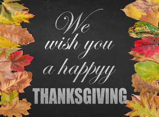 We wish you a happy Thanksgiving day design quote postcard banner with autumn leaves